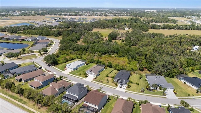 birds eye view of property featuring a water view and a residential view
