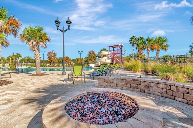 4515 Roycroft Ter, Parrish, FL 34219 - surrounding community with a swimming pool and a patio area