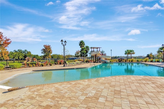 4515 Roycroft Ter, Parrish, FL 34219 - community pool featuring a water slide, a patio, and a playground