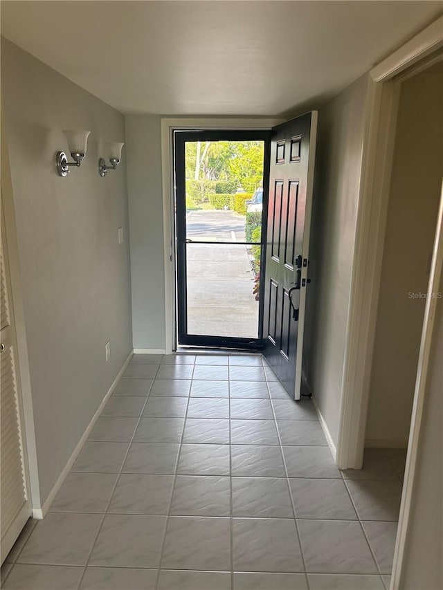 7050 Fairway Bend Ln Unit 167, Sarasota, FL 34243 - foyer with baseboards and light tile patterned floors