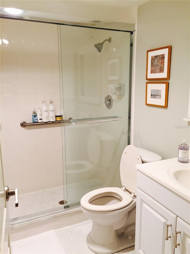 7050 Fairway Bend Ln Unit 167, Sarasota, FL 34243 - bathroom featuring a shower stall, toilet, and vanity