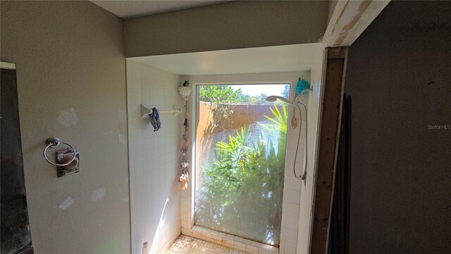 full bathroom featuring walk in shower and tile patterned floors