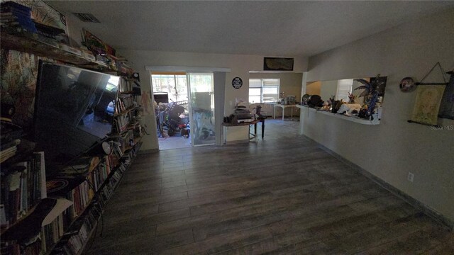 interior space with visible vents and wood finished floors