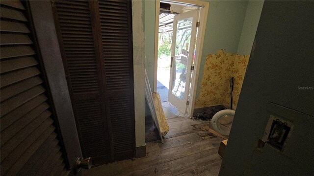 interior space featuring a heating unit and wood finished floors
