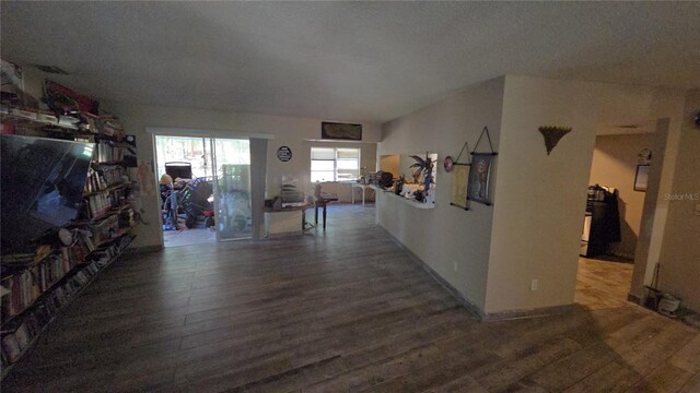 corridor featuring wood finished floors