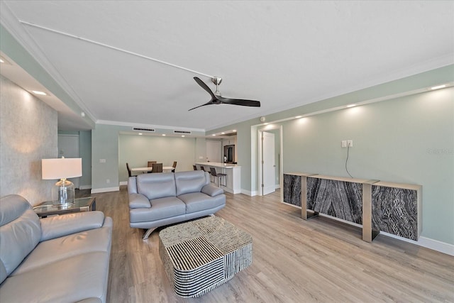 1212 Benjamin Franklin Dr Unit 306, Sarasota, FL 34236 - living room with light wood-type flooring, ornamental molding, baseboards, and a ceiling fan