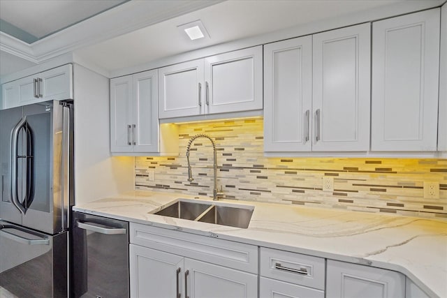 1212 Benjamin Franklin Dr Unit 306, Sarasota, FL 34236 - kitchen with appliances with stainless steel finishes, a sink, and white cabinetry
