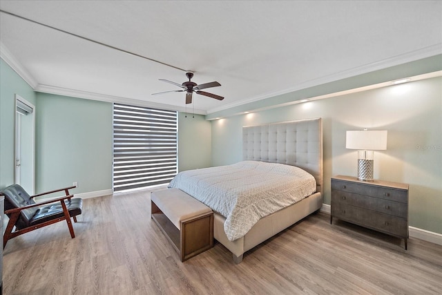 1212 Benjamin Franklin Dr Unit 306, Sarasota, FL 34236 - bedroom with ornamental molding, baseboards, wood finished floors, and ceiling fan