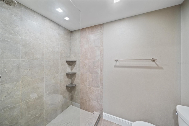 1212 Benjamin Franklin Dr Unit 306, Sarasota, FL 34236 - full bathroom with toilet, a walk in shower, and baseboards