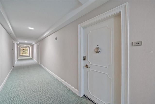 1212 Benjamin Franklin Dr Unit 306, Sarasota, FL 34236 - hallway with light colored carpet, baseboards, and recessed lighting