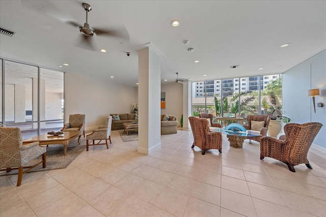 1212 Benjamin Franklin Dr Unit 306, Sarasota, FL 34236 - living area featuring floor to ceiling windows, a ceiling fan, recessed lighting, light tile patterned floors, and baseboards