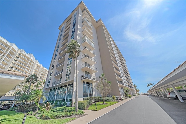 1212 Benjamin Franklin Dr Unit 306, Sarasota, FL 34236 - view of apartment building / complex featuring covered parking