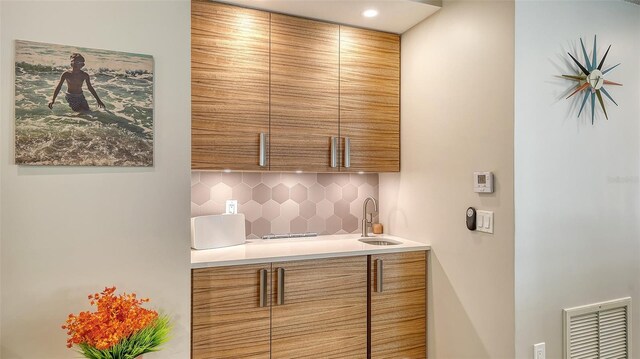 3605 Quail Hollow Ln, Bradenton, FL 34210 - bar with a sink, decorative backsplash, and visible vents
