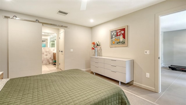 3605 Quail Hollow Ln, Bradenton, FL 34210 - bedroom featuring light tile patterned floors, visible vents, a barn door, baseboards, and recessed lighting