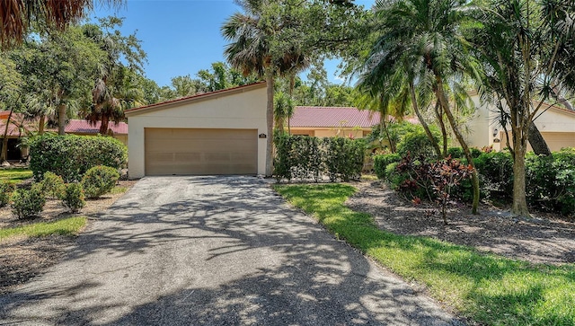 3605 Quail Hollow Ln, Bradenton, FL 34210 - view of front of home with driveway, stucco siding, and a garage