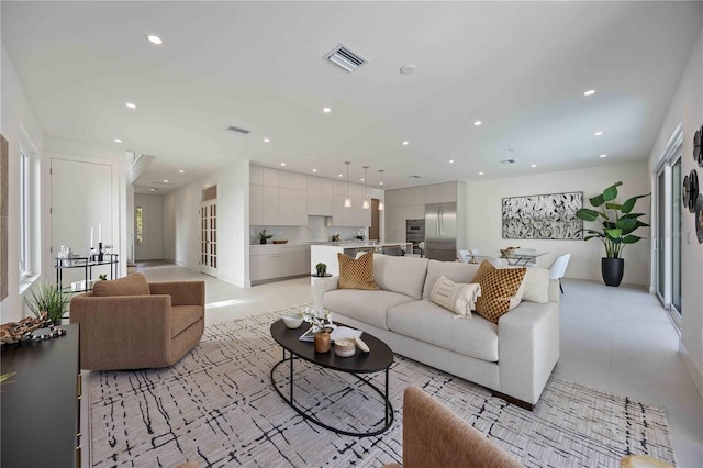 2590 Floyd St, Sarasota, FL 34239 - living room featuring recessed lighting, light tile patterned floors, and baseboards