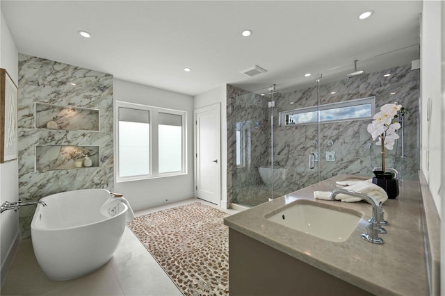 2590 Floyd St, Sarasota, FL 34239 - bathroom featuring a marble finish shower, recessed lighting, vanity, and a soaking tub