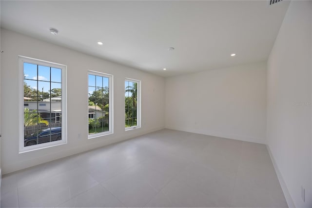 2590 Floyd St, Sarasota, FL 34239 - empty room with recessed lighting, baseboards, and light tile patterned floors