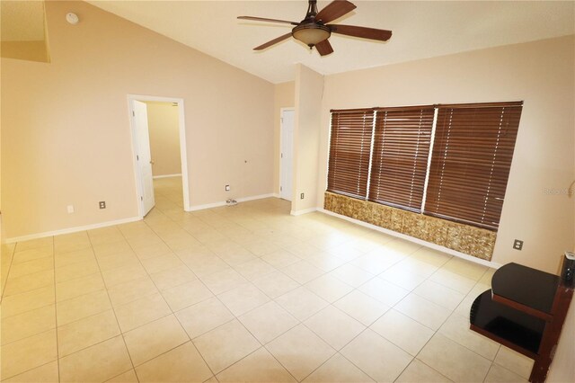 2521 Tamarind Dr, Edgewater, FL 32141 - unfurnished room featuring tile patterned flooring, ceiling fan, lofted ceiling, and baseboards