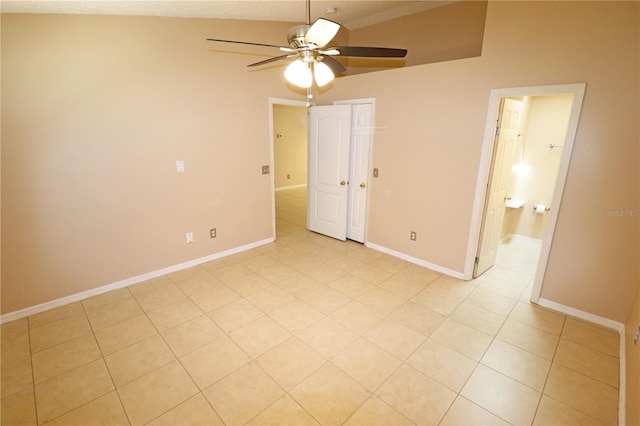 2521 Tamarind Dr, Edgewater, FL 32141 - unfurnished bedroom featuring light tile patterned floors, a ceiling fan, a closet, and baseboards