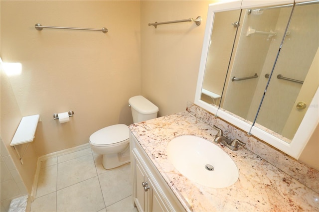 2521 Tamarind Dr, Edgewater, FL 32141 - bathroom with vanity, toilet, baseboards, walk in shower, and tile patterned flooring