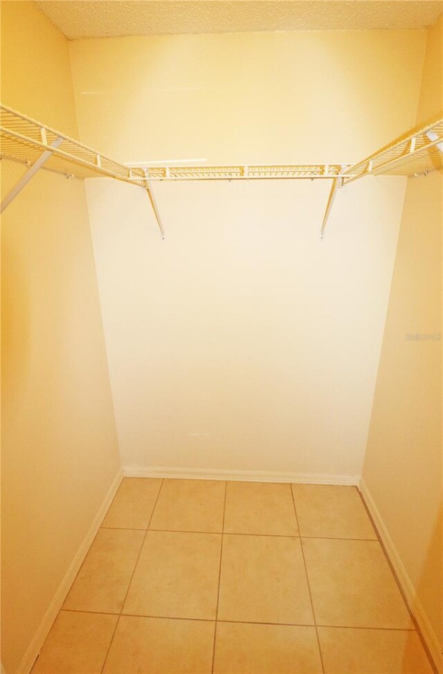 2521 Tamarind Dr, Edgewater, FL 32141 - spacious closet with light tile patterned floors