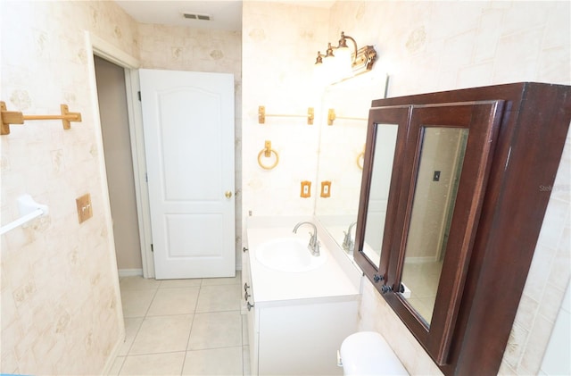 2521 Tamarind Dr, Edgewater, FL 32141 - bathroom with toilet, visible vents, vanity, and tile patterned flooring