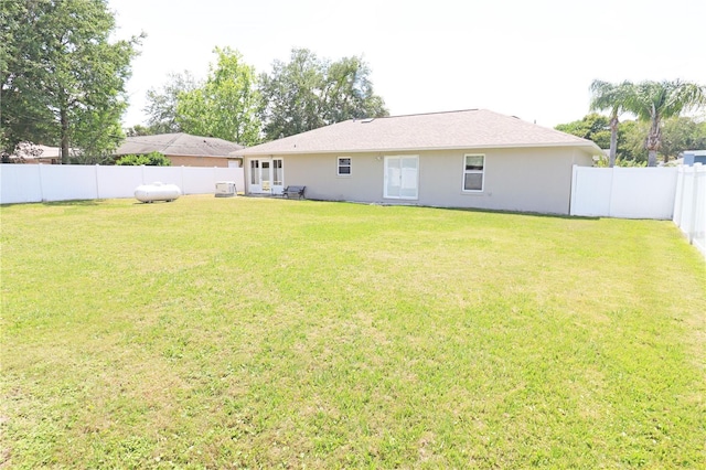2521 Tamarind Dr, Edgewater, FL 32141 - rear view of property featuring a yard and a fenced backyard
