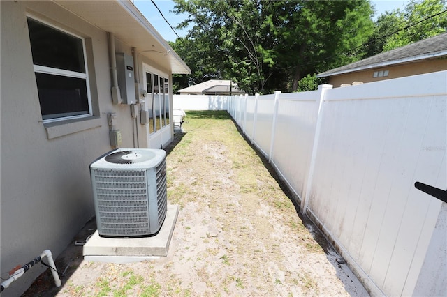 2521 Tamarind Dr, Edgewater, FL 32141 - view of yard featuring a fenced backyard and central AC unit