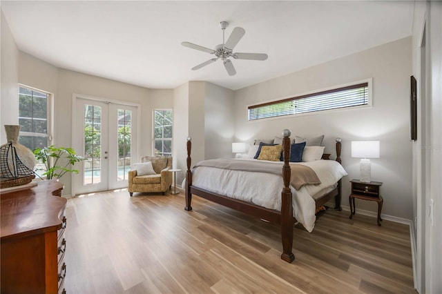 bedroom featuring access to exterior, light wood finished floors, baseboards, french doors, and a ceiling fan