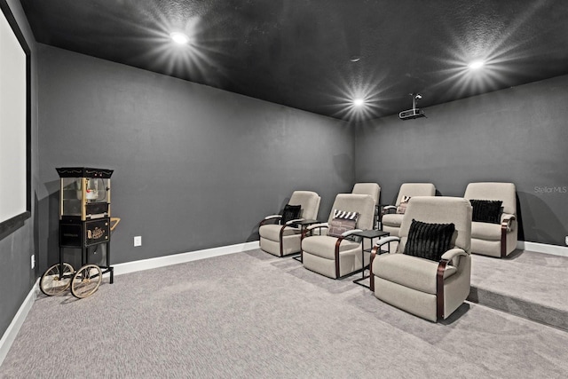 carpeted cinema room featuring recessed lighting and baseboards