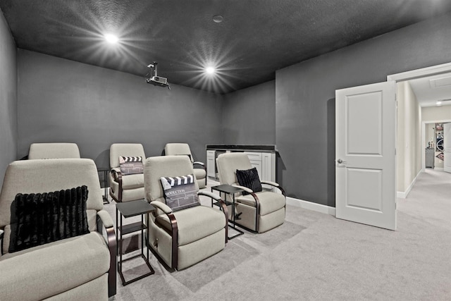cinema featuring recessed lighting, baseboards, and light carpet