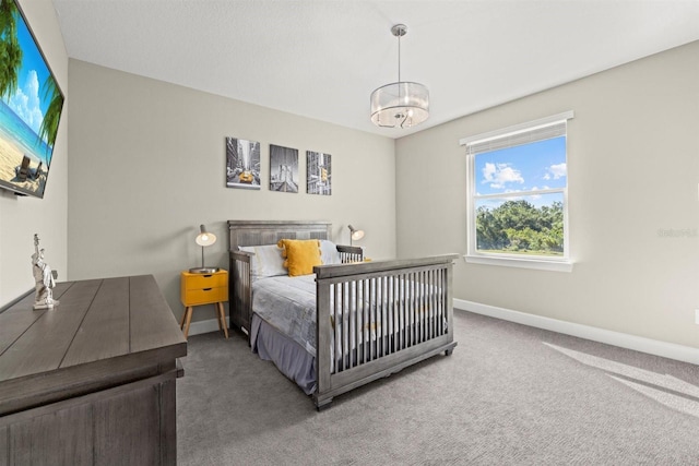 bedroom featuring baseboards and carpet flooring