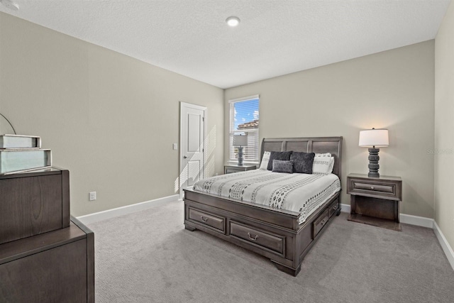bedroom with carpet floors and baseboards