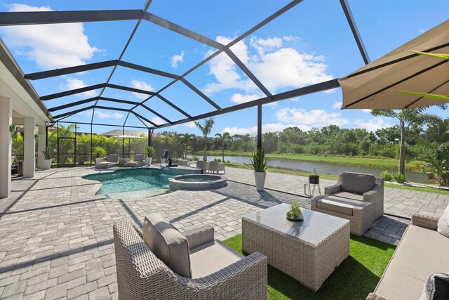 view of pool with a lanai, a patio, an outdoor living space, and a water view
