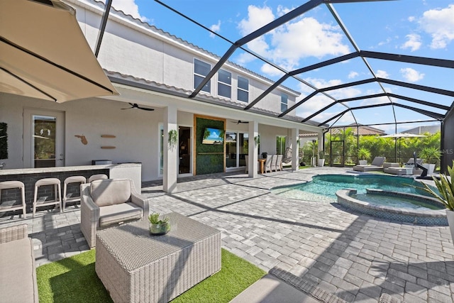 view of swimming pool with a ceiling fan, a patio, a pool with connected hot tub, and outdoor lounge area