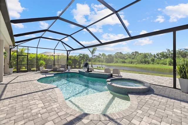 view of swimming pool featuring a water view, a pool with connected hot tub, a lanai, and a patio area