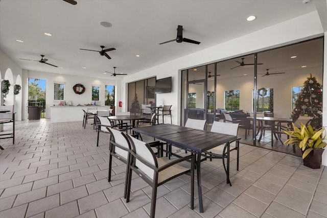 dining room featuring recessed lighting, ceiling fan, and light tile patterned flooring
