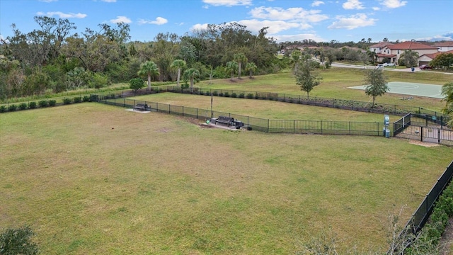 view of yard featuring a rural view and fence