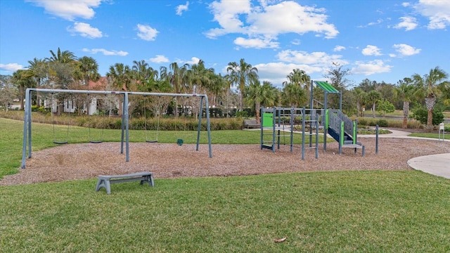 community jungle gym featuring a lawn