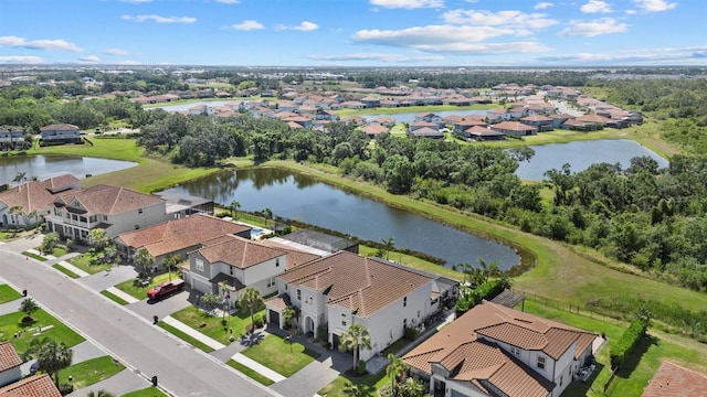bird's eye view with a water view and a residential view