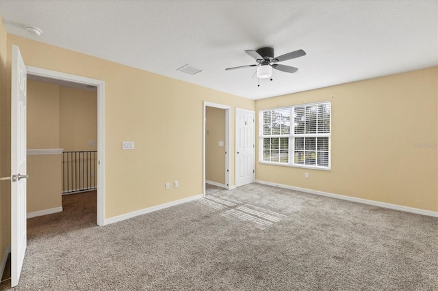 unfurnished bedroom featuring a ceiling fan, baseboards, and carpet