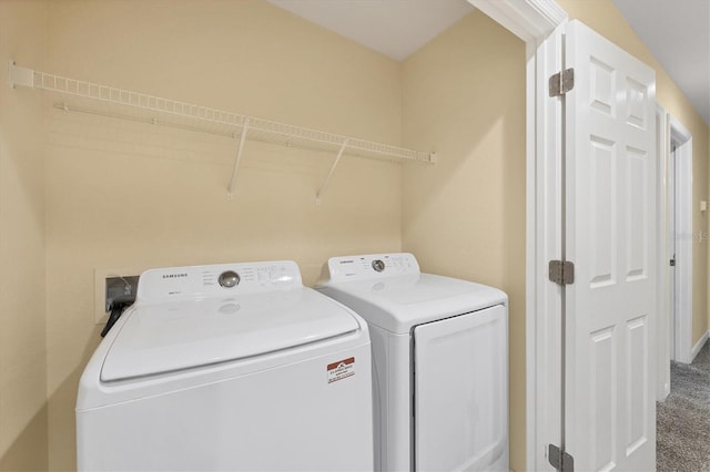 laundry room featuring carpet floors, laundry area, and washing machine and dryer