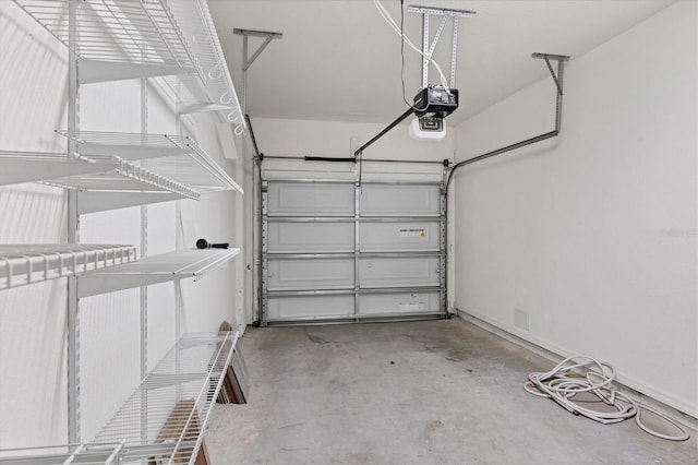 garage featuring a garage door opener