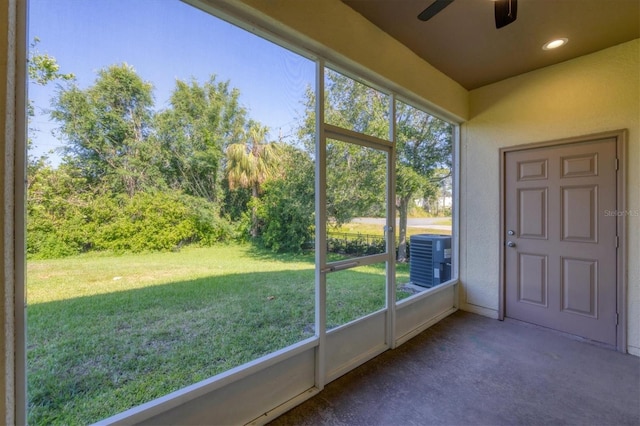doorway to outside featuring recessed lighting, carpet flooring, ceiling fan, and a wealth of natural light