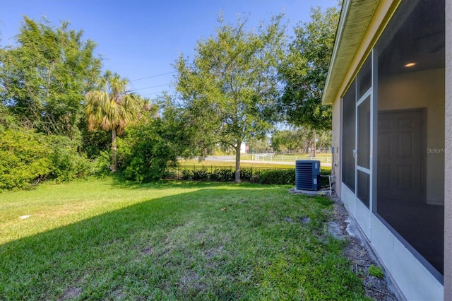 view of yard with central AC unit