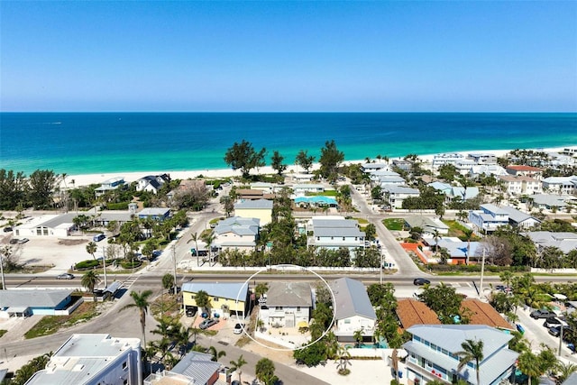 drone / aerial view featuring a water view and a residential view