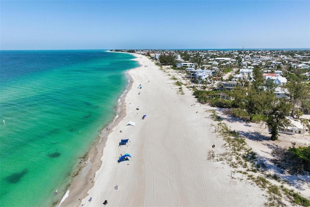 aerial view featuring a view of the beach and a water view