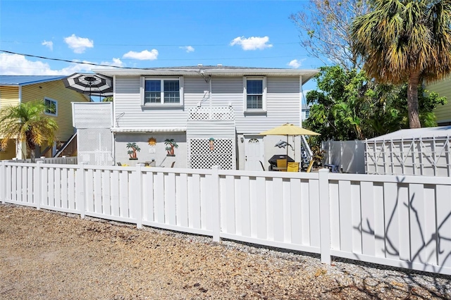back of house with fence private yard
