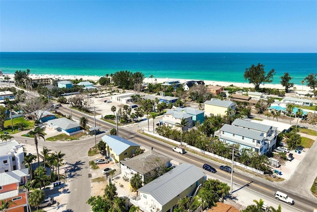 birds eye view of property with a view of the beach and a water view